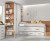 Habitación infantil con cama nido con 3 cajones y escalera, armario de rincón y escritorio con cajones