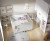 Habitación bebé gemelar con doble cuna convertible y armario